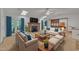 Spacious living room featuring a fireplace, vaulted ceilings, sky lights, hardwood floors and comfortable seating at 480 Big Branch Dr, Pittsboro, NC 27312
