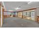 Expansive room featuring a large carpeted area with doorway to a living room and kitchen at 480 Big Branch Dr, Pittsboro, NC 27312