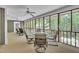 Screened-in patio with multiple seating areas, ideal for relaxation at 480 Big Branch Dr, Pittsboro, NC 27312