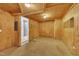 Versatile room features wood-paneled walls, neutral decor, and access to other rooms at 480 Big Branch Dr, Pittsboro, NC 27312