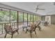 Inviting screened porch with multiple seating areas, perfect for relaxation and outdoor enjoyment at 480 Big Branch Dr, Pittsboro, NC 27312