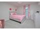 Charming pink bedroom with decorative wall roses, a comfy bed, and a matching pink dresser at 490 Mallard Loop Dr Dr, Clayton, NC 27527