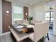 Bright dining room featuring stylish decor and sliding doors to the outdoor space at 490 Mallard Loop Dr Dr, Clayton, NC 27527