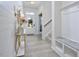Bright and open entryway with wood look tile flooring, a console table, and a built-in bench with storage at 490 Mallard Loop Dr Dr, Clayton, NC 27527