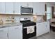 Well-appointed kitchen featuring white cabinets, granite countertops, stainless appliances, and plenty of storage at 490 Mallard Loop Dr Dr, Clayton, NC 27527