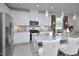 Modern kitchen featuring stainless steel appliances, granite countertops, and an island with seating at 490 Mallard Loop Dr Dr, Clayton, NC 27527