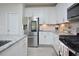 Modern kitchen with stainless steel appliances, white cabinets and granite countertops at 490 Mallard Loop Dr Dr, Clayton, NC 27527