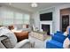 Cozy living room with fireplace, modern furnishings and ample natural light at 490 Mallard Loop Dr Dr, Clayton, NC 27527