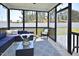 Inviting screened-in porch with outdoor seating, lighting, and backyard view at 490 Mallard Loop Dr Dr, Clayton, NC 27527