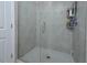 Modern shower with gray tiled walls, a glass door, and a built-in shelf for toiletries at 490 Mallard Loop Dr Dr, Clayton, NC 27527