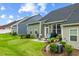 Exterior view of home with patio space, lawn and landscaping features at 518 Judge Ct, Durham, NC 27703