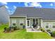 Backyard patio, lawn, and landscaping seen in this home's exterior at 518 Judge Ct, Durham, NC 27703