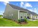 Backyard featuring a patio, seating area, lush green lawn, and well-maintained landscaping at 518 Judge Ct, Durham, NC 27703