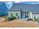 Backyard features a patio area with outdoor furniture and a well-maintained lawn at 518 Judge Ct, Durham, NC 27703