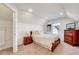 Cozy bedroom with sloped ceilings, recessed lighting, and warm neutral carpet at 518 Judge Ct, Durham, NC 27703