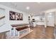 Dining room with a wooden table, white chairs, and an open view to the kitchen at 518 Judge Ct, Durham, NC 27703