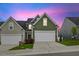 Charming home featuring a two-car garage, well-manicured lawn, and inviting curb appeal at 518 Judge Ct, Durham, NC 27703