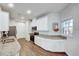 Well-lit kitchen features granite countertops, stainless steel appliances, and modern cabinetry at 518 Judge Ct, Durham, NC 27703