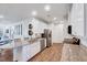 Modern kitchen featuring granite countertops, stainless steel appliances, and white cabinets at 518 Judge Ct, Durham, NC 27703