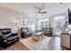 Bright living room featuring a large window, hardwood floors, and modern furniture at 518 Judge Ct, Durham, NC 27703