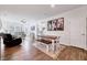 Bright living room featuring hardwood floors, comfortable seating, and an open floor plan at 518 Judge Ct, Durham, NC 27703