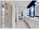 Stylishly-appointed bathroom with double sinks, a glass shower, and plenty of natural light at 518 Judge Ct, Durham, NC 27703