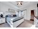 Comfortable bedroom with a ceiling fan, a stairway door and a sliding door to the bathroom at 518 Judge Ct, Durham, NC 27703