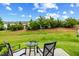 Back patio area with seating, perfect for outdoor relaxation and entertaining at 518 Judge Ct, Durham, NC 27703