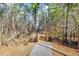 Scenic walking path featuring a wooden bridge and natural wooded surroundings at 518 Judge Ct, Durham, NC 27703