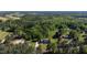 Expansive aerial view of a wooded property featuring a home with mature trees at 530 Turlington Rd, Dunn, NC 28334
