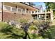 Backyard featuring a raised garden bed with a variety of plants and flowers at 530 Turlington Rd, Dunn, NC 28334