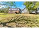 Picturesque backyard featuring a large lawn and a deck, ideal for outdoor enjoyment and activities at 530 Turlington Rd, Dunn, NC 28334