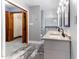Bathroom featuring a double sink vanity and a private closet space at 530 Turlington Rd, Dunn, NC 28334