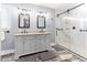 Bathroom featuring a double sink vanity and a glass shower at 530 Turlington Rd, Dunn, NC 28334