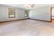 Bright bedroom featuring plush carpet, wood trim, and two windows at 530 Turlington Rd, Dunn, NC 28334