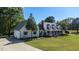 Stunning home with attached garage, well-manicured lawn, and inviting front porch at 530 Turlington Rd, Dunn, NC 28334