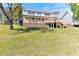 Exterior showcasing the home with a two-tiered deck, complemented by a well-maintained yard at 530 Turlington Rd, Dunn, NC 28334