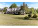 Charming home with a manicured lawn, mature trees, and inviting curb appeal at 530 Turlington Rd, Dunn, NC 28334