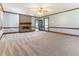 Comfortable living room featuring plush carpet and a brick fireplace at 530 Turlington Rd, Dunn, NC 28334
