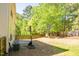 Exterior shot of backyard with a basketball hoop and fenced perimeter at 6 Dawson Ct Ct, Durham, NC 27703