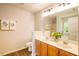 Bright bathroom featuring a double sink vanity, decorative towels, and a shower with glass door at 6 Dawson Ct Ct, Durham, NC 27703