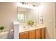 Bright bathroom featuring a double sink vanity and white molding and trim throughout at 6 Dawson Ct Ct, Durham, NC 27703