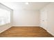 Spacious bedroom features wood-look flooring, a large window for natural light, and ample closet space at 6 Dawson Ct Ct, Durham, NC 27703