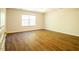 Spacious bedroom with wood-look floors and a ceiling fan at 6 Dawson Ct Ct, Durham, NC 27703