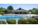 Community pool with lounge chairs, picnic tables, and a splash fountain at 6 Dawson Ct Ct, Durham, NC 27703