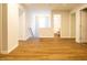 Upstairs hallway with wood-look floors and natural light at 6 Dawson Ct Ct, Durham, NC 27703