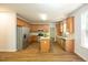 Spacious kitchen features stainless steel appliances, granite countertops, an island and wood-look flooring at 6 Dawson Ct Ct, Durham, NC 27703