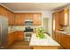 Open kitchen with stainless steel appliances, granite countertops, a central island, and ample cabinet space at 6 Dawson Ct Ct, Durham, NC 27703