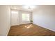 Inviting living room showcasing natural light, wood-look floors, and a fresh, neutral color palette at 6 Dawson Ct Ct, Durham, NC 27703