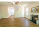 Open living room with fireplace and wood-look floors at 6 Dawson Ct Ct, Durham, NC 27703